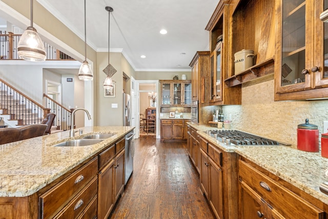8917 Cypress Creek Rd, Lantana, TX 76226 - kitchen with a sink, brown cabinets, dark wood-style flooring, decorative light fixtures, and ornamental molding