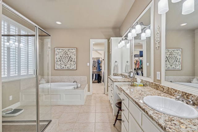 8917 Cypress Creek Rd, Lantana, TX 76226 - bathroom with a shower stall, vanity, a bath, tile patterned flooring, and a spacious closet