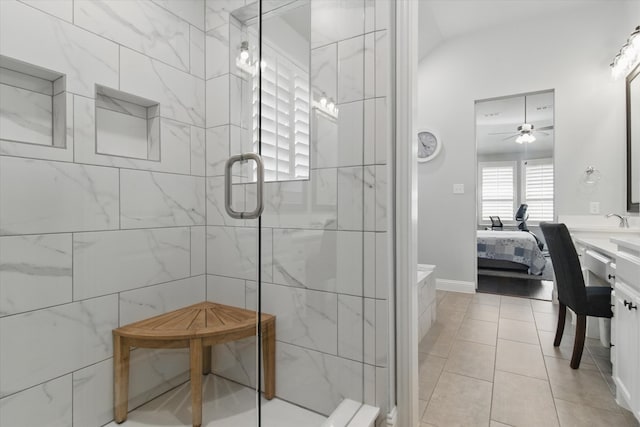 3503 Jersey Rd, Melissa, TX 75454 - bathroom with connected bathroom, a shower stall, a ceiling fan, vanity, and tile patterned floors