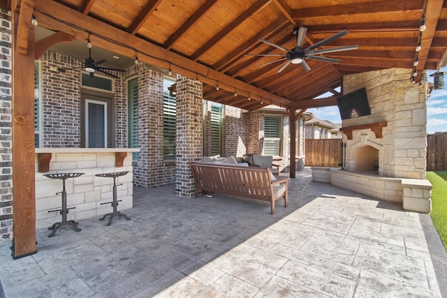 3503 Jersey Rd, Melissa, TX 75454 - view of patio / terrace with ceiling fan, an outdoor living space with a fireplace, and fence