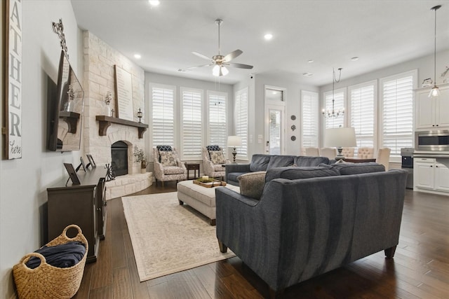3503 Jersey Rd, Melissa, TX 75454 - living area with a stone fireplace, healthy amount of natural light, ceiling fan, recessed lighting, and dark wood-style flooring