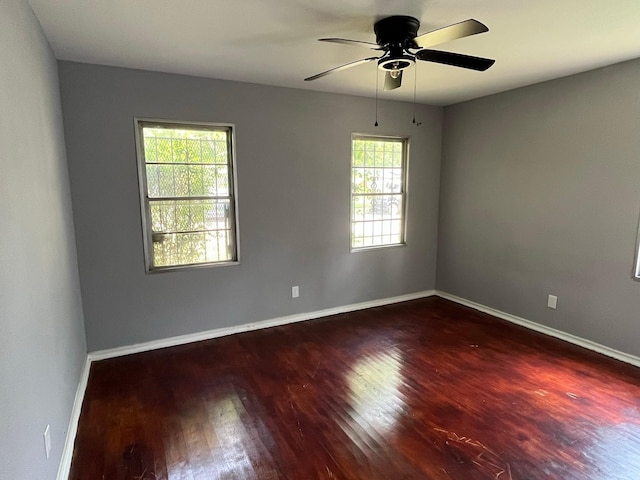 2836 Modree Ave, Dallas, TX 75216 - unfurnished room featuring wood finished floors, ceiling fan, and baseboards