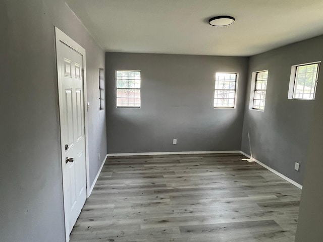 2836 Modree Ave, Dallas, TX 75216 - unfurnished room featuring wood finished floors and baseboards