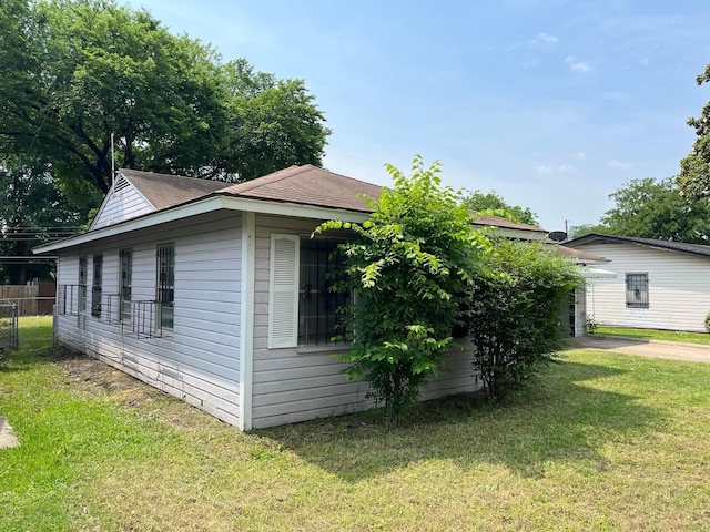2836 Modree Ave, Dallas, TX 75216 - view of home's exterior featuring roof with shingles