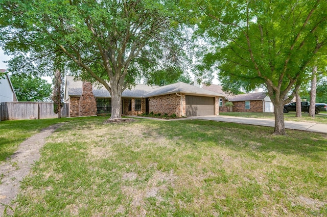 2005 Parkside Dr, Denton, TX 76201 - single story home with driveway, a garage, a chimney, and brick siding