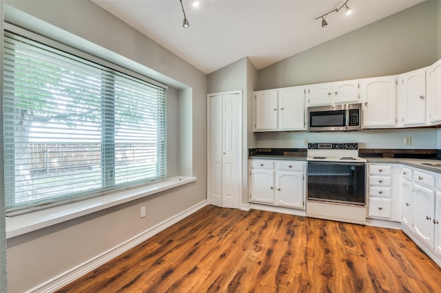2005 Parkside Dr, Denton, TX 76201 - kitchen featuring stainless steel microwave, electric stove, vaulted ceiling, white cabinets, and dark wood-type flooring