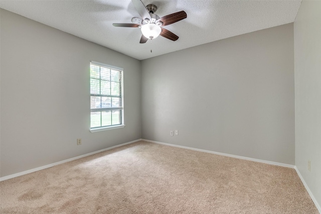 2005 Parkside Dr, Denton, TX 76201 - carpeted empty room featuring a ceiling fan, a textured ceiling, and baseboards