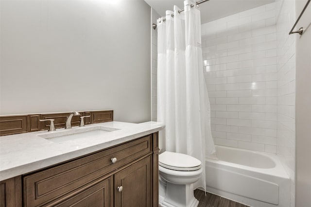 2005 Parkside Dr, Denton, TX 76201 - bathroom with toilet, wood finished floors, shower / bath combination with curtain, and vanity