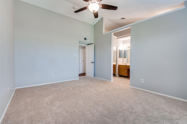 2005 Parkside Dr, Denton, TX 76201 - unfurnished bedroom with light carpet, lofted ceiling, baseboards, ensuite bathroom, and ceiling fan