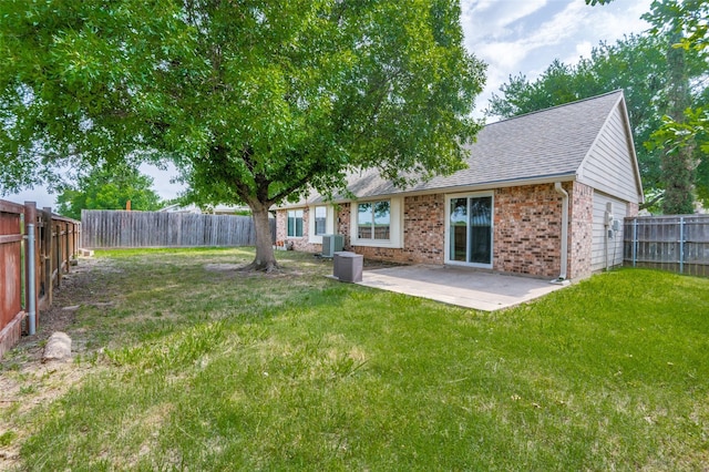 2005 Parkside Dr, Denton, TX 76201 - view of yard with central air condition unit and a patio