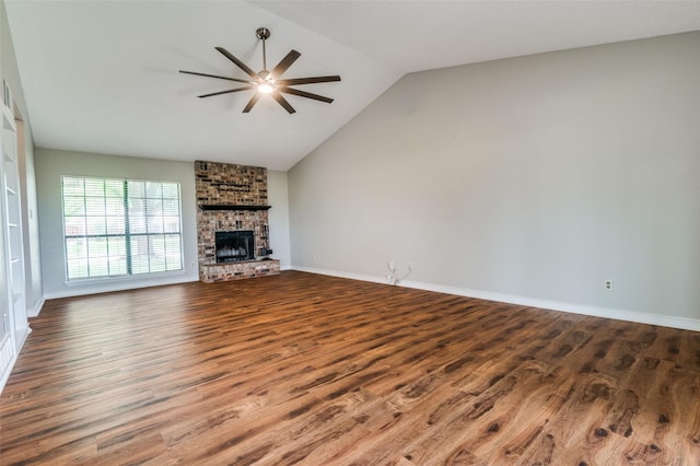 2005 Parkside Dr, Denton, TX 76201 - unfurnished living room with ceiling fan, wood finished floors, a fireplace, lofted ceiling, and baseboards