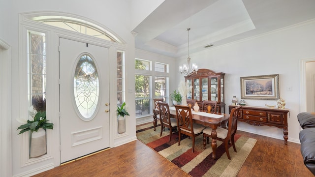 253 Valtie Davis Rd, Combine, TX 75159 - entrance foyer with dark wood-style flooring, a chandelier, ornamental molding, and a raised ceiling