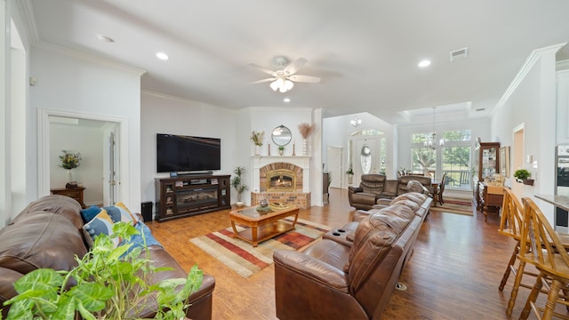 253 Valtie Davis Rd, Combine, TX 75159 - living area featuring wood finished floors, ceiling fan, a chandelier, crown molding, and recessed lighting
