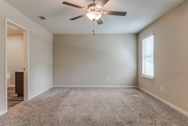 412 Lowery Oaks Trl, Fort Worth, TX 76120 - spare room with carpet, a ceiling fan, and baseboards