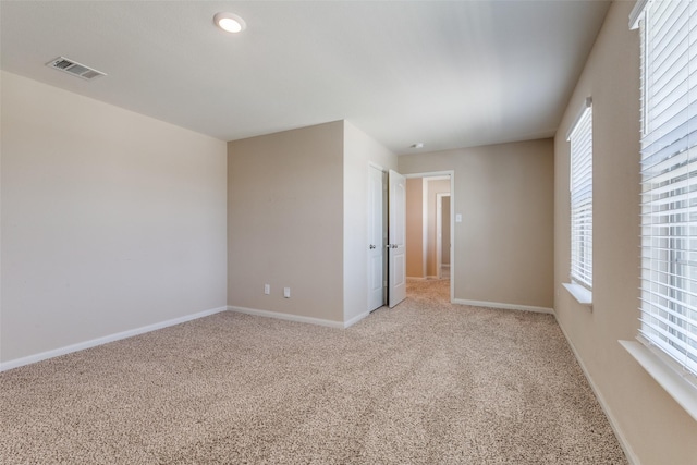 412 Lowery Oaks Trl, Fort Worth, TX 76120 - spare room featuring healthy amount of natural light, light colored carpet, and baseboards