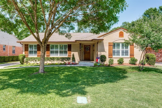 7219 Haverford Rd, Dallas, TX 75214 - ranch-style house with brick siding, a front yard, and a shingled roof
