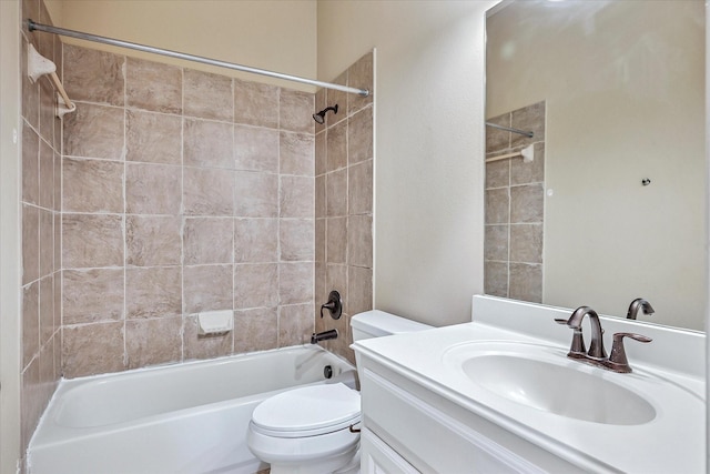 bathroom featuring toilet, washtub / shower combination, and vanity
