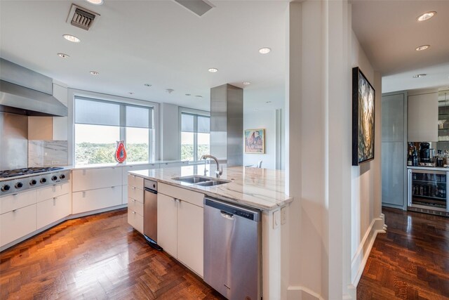 4500 Roland Ave Unit 801, Highland Park, TX 75219 - kitchen featuring stainless steel appliances, beverage cooler, a sink, light stone countertops, and modern cabinets