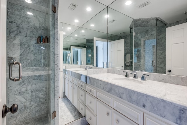 4500 Roland Ave Unit 801, Highland Park, TX 75219 - full bath with double vanity, a marble finish shower, recessed lighting, and marble finish floors