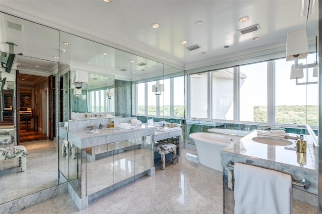 4500 Roland Ave Unit 801, Highland Park, TX 75219 - full bath featuring crown molding, a soaking tub, marble tiled flooring, and two vanities