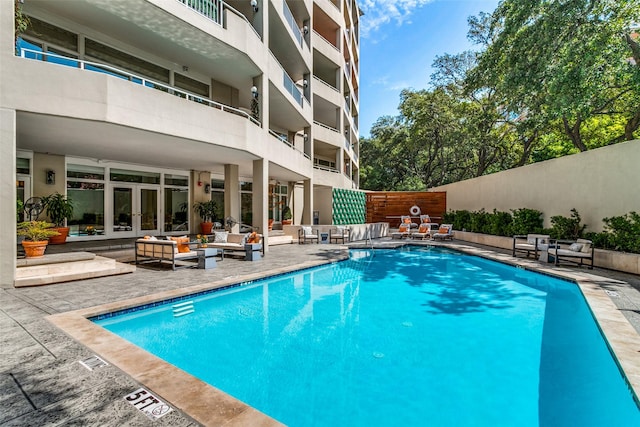 4500 Roland Ave Unit 801, Highland Park, TX 75219 - community pool with french doors, an outdoor hangout area, and a patio area