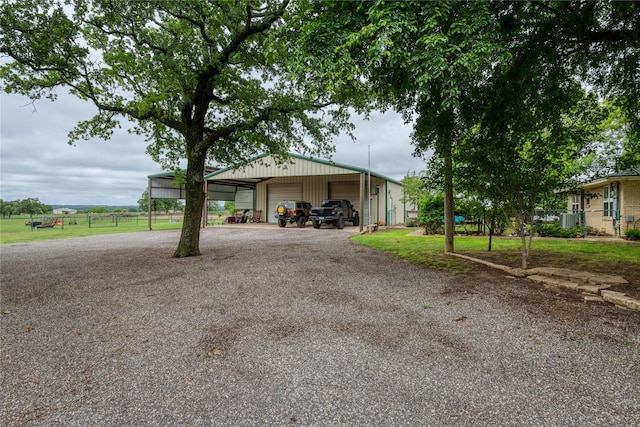2405 Poolville Cut Off Rd, Poolville, TX 76487 - view of front facade with a detached garage, an outbuilding, and fence