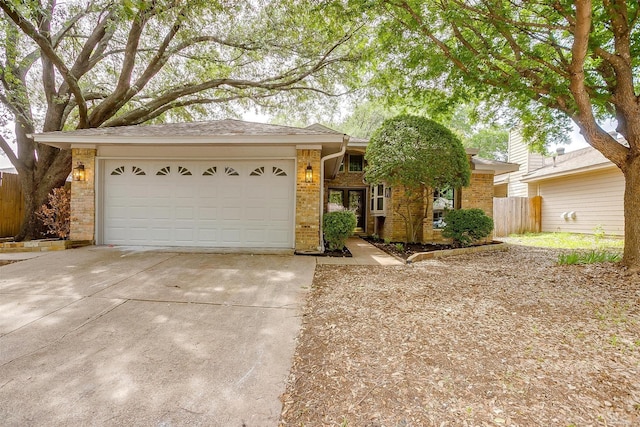 2204 Mediterranean Ave, Arlington, TX 76011 - single story home featuring brick siding, driveway, fence, and a garage