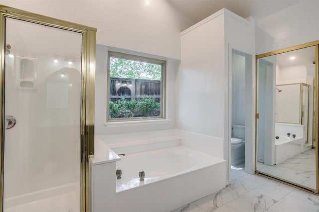 2204 Mediterranean Ave, Arlington, TX 76011 - bathroom featuring a stall shower, marble look tile flooring, toilet, and a garden tub