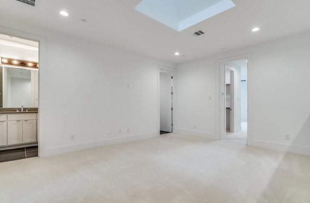 822 Eaglescliffe Lndg, Wylie, TX 75098 - empty room with recessed lighting, a skylight, a sink, light colored carpet, and baseboards