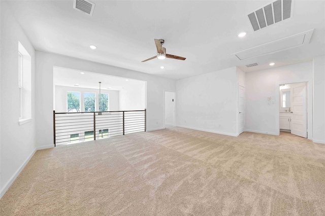 220 E Park St, Little Elm, TX 75068 - spare room featuring attic access, light carpet, a ceiling fan, recessed lighting, and baseboards
