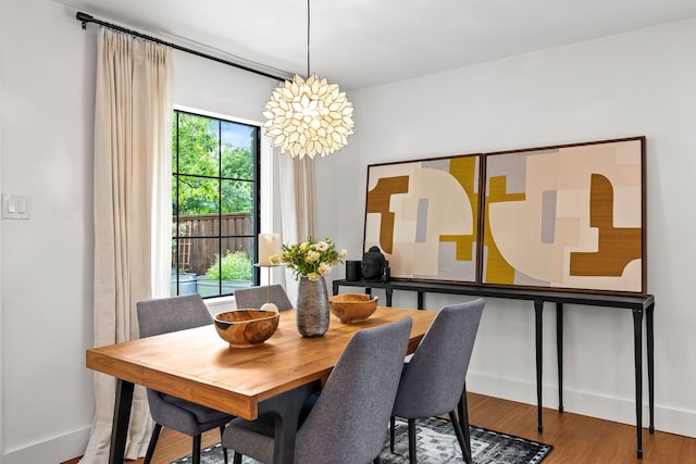 9115 Longmont Dr, Dallas, TX 75238 - dining room with wood finished floors and baseboards