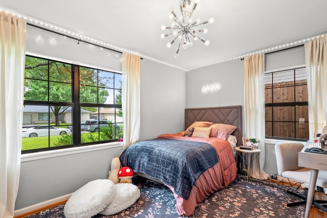 9115 Longmont Dr, Dallas, TX 75238 - bedroom with a chandelier