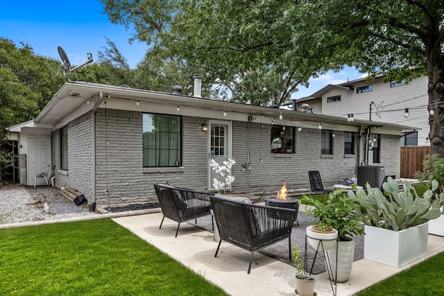 9115 Longmont Dr, Dallas, TX 75238 - rear view of property with a fire pit, a patio area, brick siding, and central AC