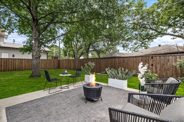 9115 Longmont Dr, Dallas, TX 75238 - view of patio / terrace with an outdoor fire pit
