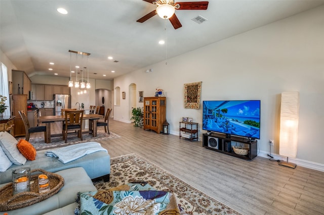 5312 Leyton Dr, Mckinney, TX 75071 - living area featuring arched walkways, ceiling fan, light wood finished floors, baseboards, and recessed lighting