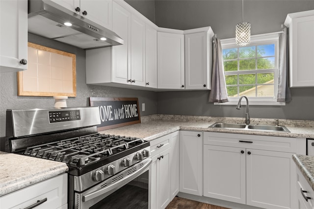 2721 Ave G, Fort Worth, TX 76105 - kitchen featuring stainless steel range with gas cooktop, under cabinet range hood, a sink, and white cabinetry