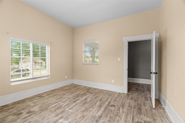 2721 Ave G, Fort Worth, TX 76105 - spare room with light wood-type flooring, healthy amount of natural light, and baseboards