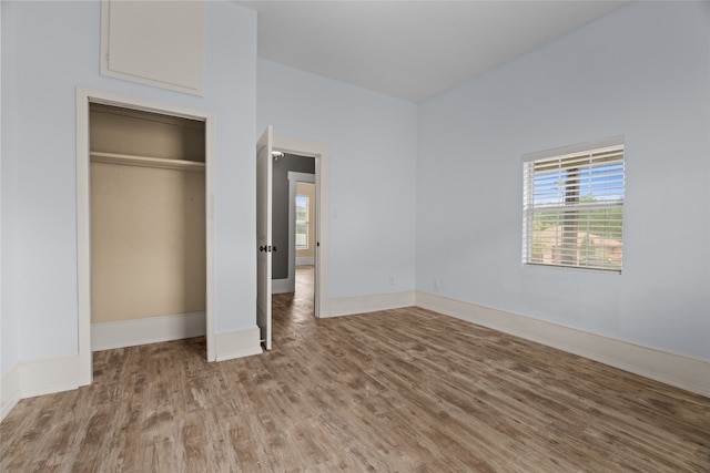 2721 Ave G, Fort Worth, TX 76105 - unfurnished bedroom with wood finished floors and baseboards