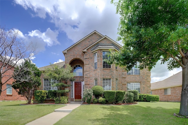 7104 Chandler Dr, Plano, TX 75024 - traditional home with brick siding and a front yard