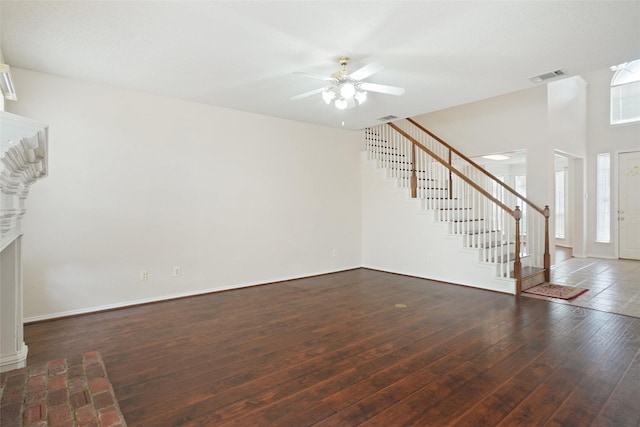 7104 Chandler Dr, Plano, TX 75024 - unfurnished living room featuring stairs, a ceiling fan, hardwood / wood-style flooring, and baseboards
