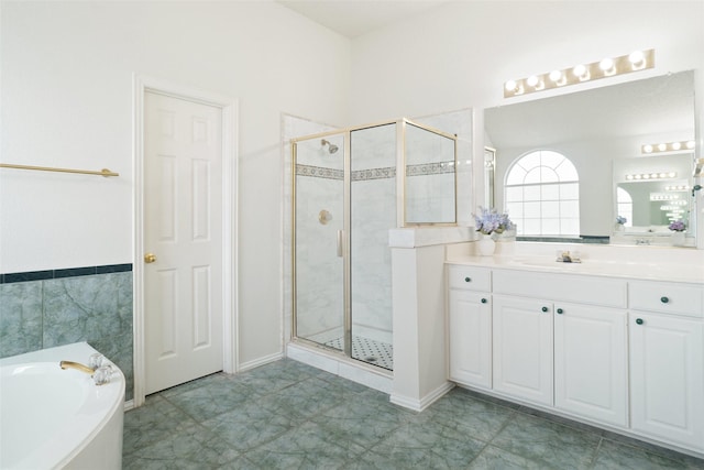 7104 Chandler Dr, Plano, TX 75024 - bathroom with a stall shower, a garden tub, and vanity
