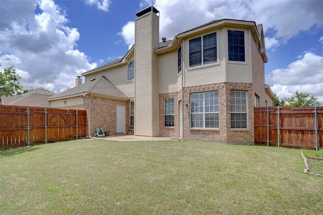 7104 Chandler Dr, Plano, TX 75024 - rear view of house with a chimney, a patio, and brick siding