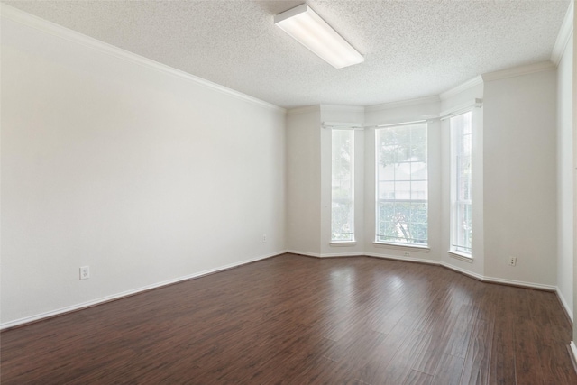 7104 Chandler Dr, Plano, TX 75024 - unfurnished room featuring dark wood-style floors, a textured ceiling, ornamental molding, and baseboards
