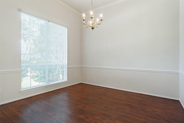 7104 Chandler Dr, Plano, TX 75024 - spare room with crown molding, a chandelier, wood finished floors, and baseboards