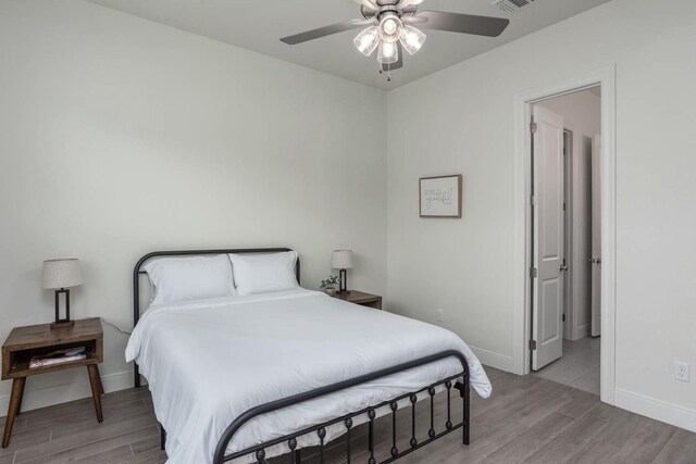 3316 Acorn Hill Trl, Weatherford, TX 76087 - bedroom with light wood-style floors, baseboards, and a ceiling fan