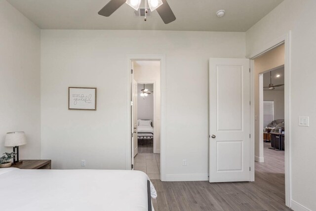 3316 Acorn Hill Trl, Weatherford, TX 76087 - bedroom featuring wood finished floors, baseboards, and a ceiling fan