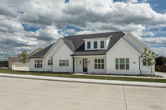 3316 Acorn Hill Trl, Weatherford, TX 76087 - modern farmhouse style home with board and batten siding, a front yard, roof with shingles, and a porch
