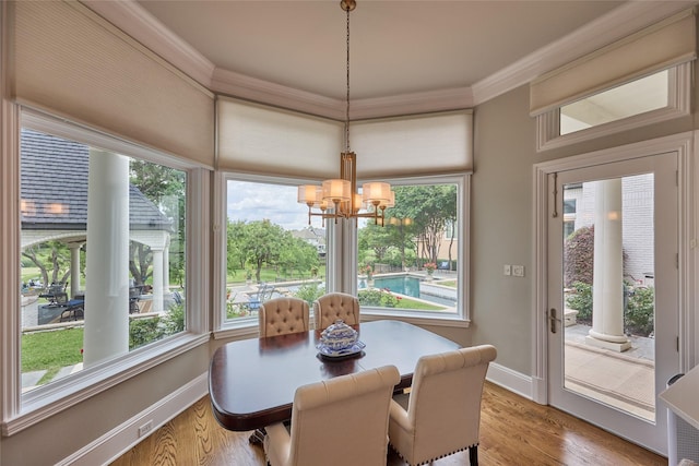 3 Savannah Ridge Dr, Frisco, TX 75034 - dining room featuring a chandelier, crown molding, baseboards, and wood finished floors