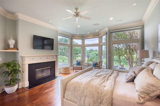 3 Savannah Ridge Dr, Frisco, TX 75034 - bedroom featuring crown molding, wood finished floors, a fireplace, and recessed lighting