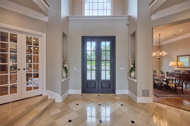 3 Savannah Ridge Dr, Frisco, TX 75034 - tiled entrance foyer with french doors, a high ceiling, healthy amount of natural light, a chandelier, and ornamental molding